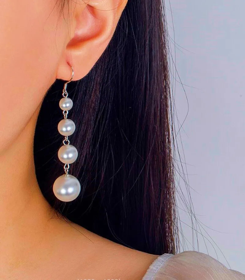 Close-up of Pearl Drop Dangle Hook Earrings with Butterfly Backs